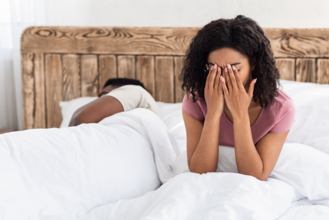woman awake due to her husband's sleep apnea